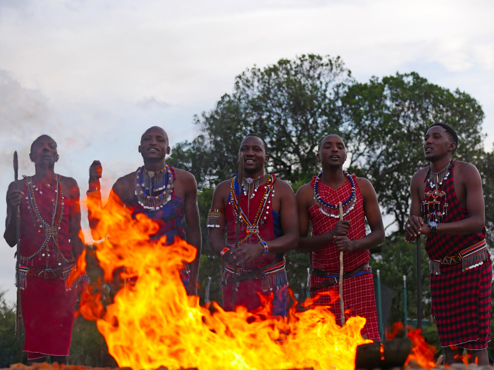 Maasai warriors by the bonfire at Loyk Mara Camp
